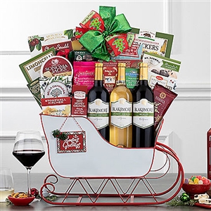 A big white metal sleigh with gourmet treats and three bottles of wine from Blakemore's winery.
